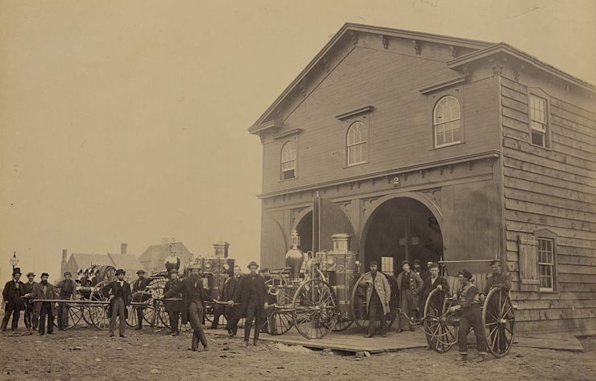 Photograph of United States Fire Department in Alexandria, Virginia with steam fire engines out front, July 1863