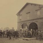 Photograph of United States Fire Department in Alexandria, Virginia with steam fire engines out front, July 1863